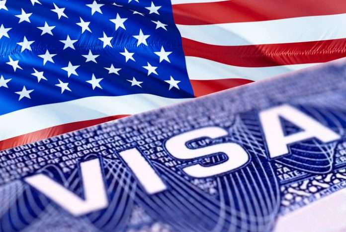 American Visa in the passport, 3D rendering. Closeup Visa to The United States of America (USA) focusing on the word VISA. Travel USA visa in passport close-up. American multi entrance in passport