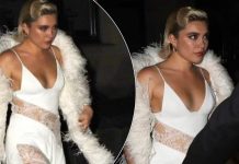 Florence Pugh mahnit me një fustan të bardhë dantelle, ndërsa shkon në festën pas çmimeve BAFTA
