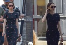 Lily Collins duket elegante si gjithmonë me një fustan të ngushtë deri poshtë gjurit teksa xhiron skena për sezonin e pestë të “Emily in Paris”